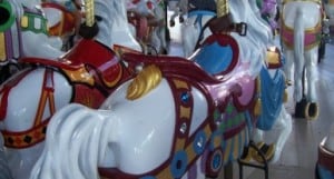 Vivid carousel horses with ornate saddles and decorations, capturing the magic of classic rides at Magic Kingdom.