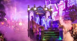A ghostly parade float shrouded in fog glides along Disney World’s lit streets, delighting excited fans and Mickey Parties devotees.