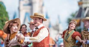 Classic Disney entertainers in retro outfits dancing by Cinderella Castle, capturing the enchanting spirit of Walt Disney World.