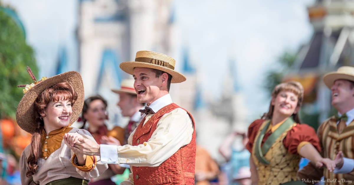 Classic Disney entertainers in retro outfits dancing by Cinderella Castle, capturing the enchanting spirit of Walt Disney World.