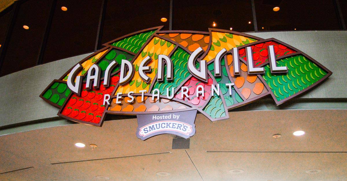 Vibrant Garden Grill Restaurant sign inside EPCOT, surrounded by lively decor—one of Disney World's top dining experiences.