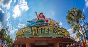 Step into The Little Mermaid at Hollywood Studios—spot Ariel and Flounder statues above and hunt for Hidden Mickeys!.