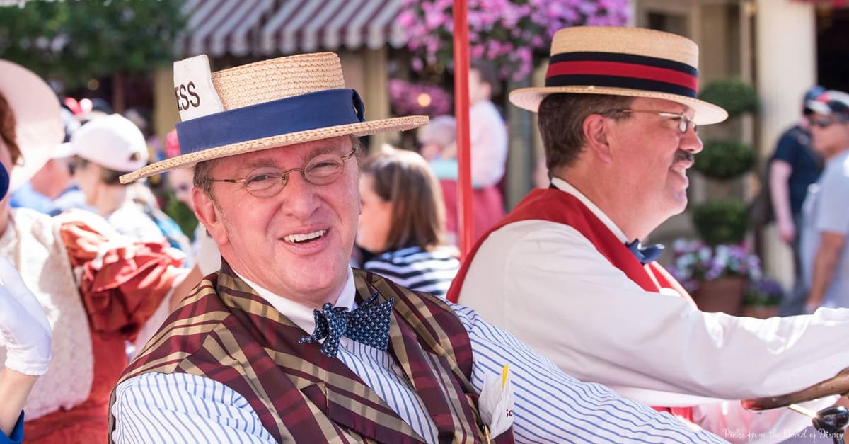 Dapper Dans in vintage attire and straw hats delight guests with a sunny outdoor performance on Main Street, U.S.A.