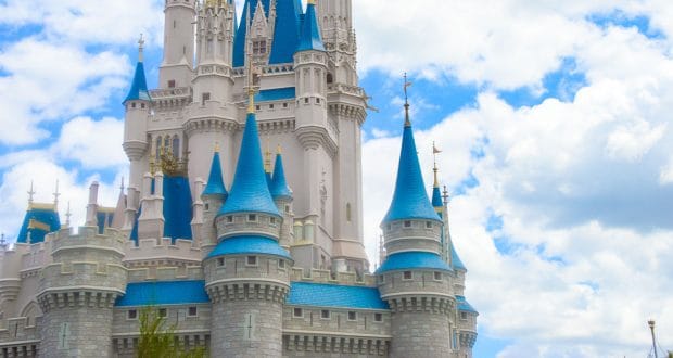 Cinderella Castle with its blue rooftops and soaring spires rises above Magic Kingdom, a must-see Disney World attraction.