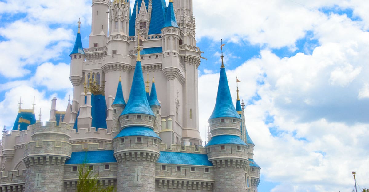 Cinderella Castle with its blue rooftops and soaring spires rises above Magic Kingdom, a must-see Disney World attraction.