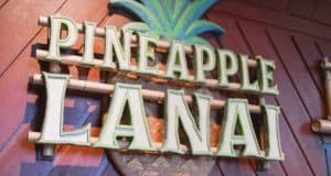 Pineapple Lanai sign with a pineapple motif at Disney’s Polynesian Village Resort, home to the popular Dole Whip treat.