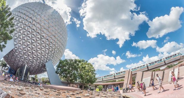 Spaceship Earth, the Epcot monorail gliding by, and excited guests exploring Disney’s futuristic park under a vibrant sky.