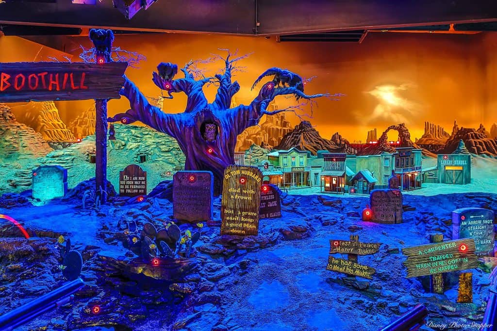 A vibrant haunted graveyard scene with tombstones, a ghostly tree, and magical lighting inspired by Disney’s Haunted Mansion.