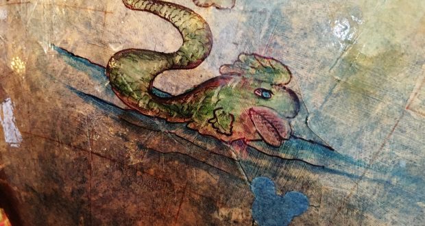 A green sea serpent appears on a vintage map next to a blue Mickey icon, teasing a secret adventure within Disney’s Resorts.