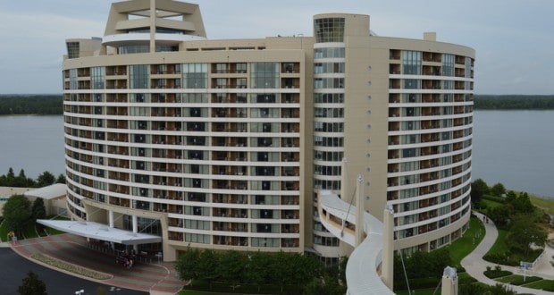 Sweeping Disney hotel with balconies overlooking the lake, linked by a sky bridge—ideal for deluxe villa stays near the parks.