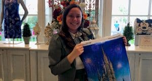 Guest in a gray blazer shops for Disney souvenirs, beaming with a castle-and-fireworks bag, ready to unlock Pro Tips magic.