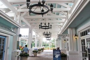 Old Key West Resort’s open house features a chandelier-lit, covered check-in area with white beams and themed event signage.