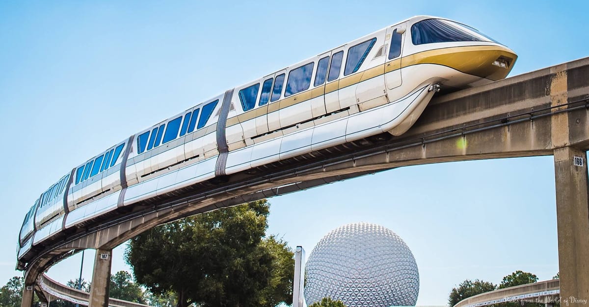 The iconic white and gold Disney World Monorail cruises past Spaceship Earth and lush trees, symbolizing seamless Park Hopper fun.