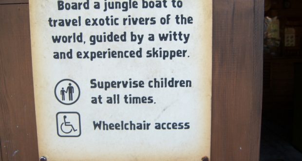 Jungle Cruise attraction sign featuring trivia, a reminder for child supervision, and details on wheelchair accessibility.