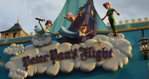Peter Pan’s Flight sign at Magic Kingdom, featuring Peter, Wendy, John & Michael soaring above Big Ben—a beloved Disney classic.
