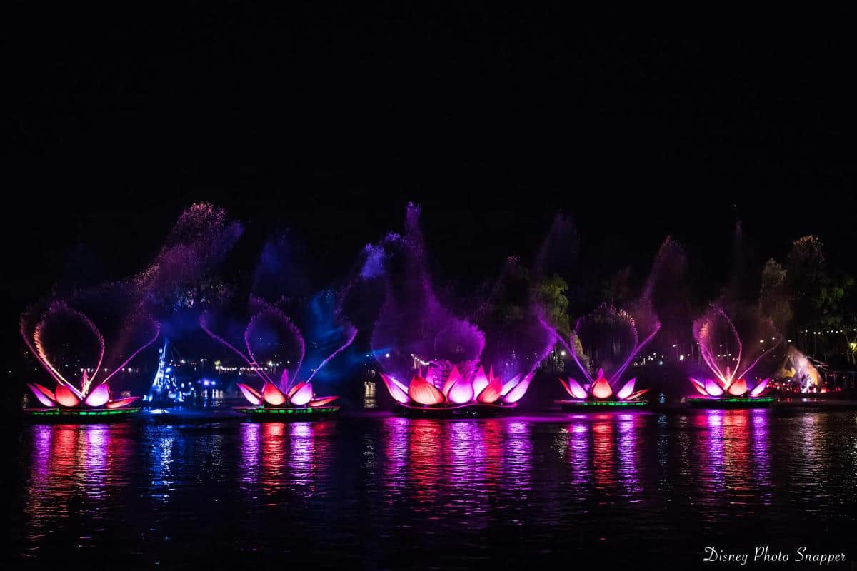 Dazzling illuminated lotus floats and fountains light up Animal Kingdom’s lake at night, creating unforgettable Disney magic.
