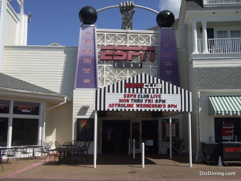 ESPN Club’s bold entrance and patio welcome Disney World guests for sun, sports, and nostalgia reminiscent of ESPN ZONE.
