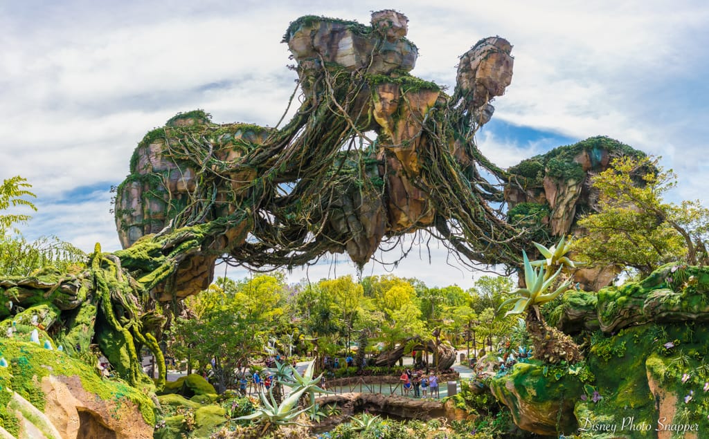 Pandora’s floating mountains draped in lush greenery rise above winding walkways at Disney’s Animal Kingdom.