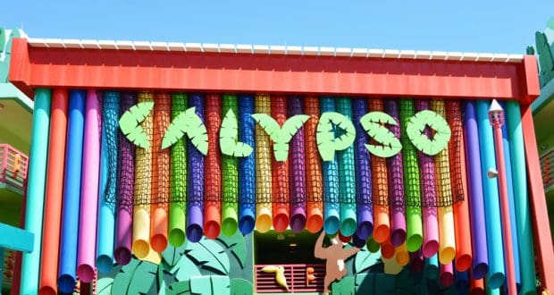 CALYPSO towers over Disney’s Value Resort entrance, with bold letters and vibrant hanging tubes welcoming guests.