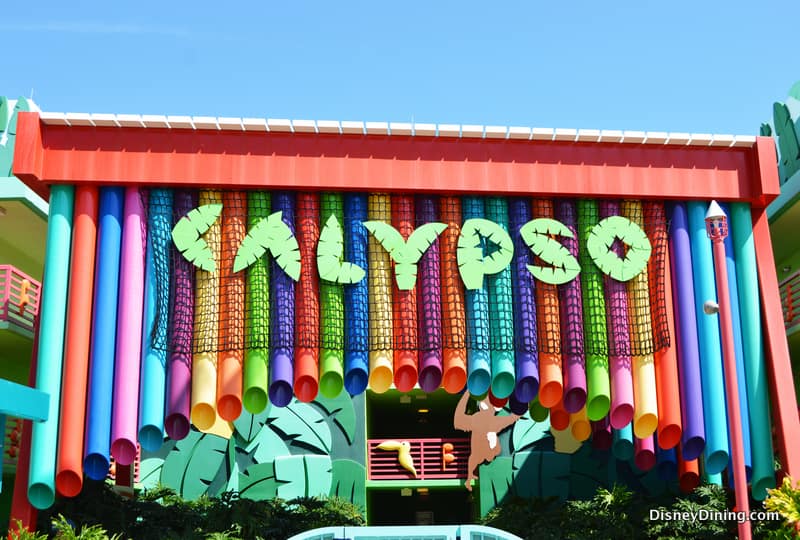 CALYPSO towers over Disney’s Value Resort entrance, with bold letters and vibrant hanging tubes welcoming guests.