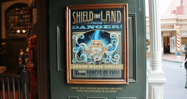 Poster on a door exclaims: “Protect this land! Kids can do hands-on activities and learn spells—just like Walt Disney World!”.
