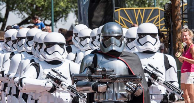 Captain Phasma leads stormtroopers in a striking Hollywood Studios parade, thrilling Star Wars fans at Walt Disney World.