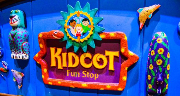 Kidcot Fun Stop sign with playful animal designs pops against a blue background—one of Disney World's must-try free activities.