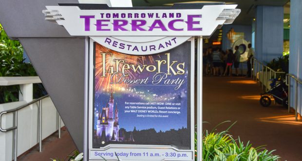 Tomorrowland Terrace sign promoting the Fireworks Dessert Party—an unforgettable Disney World must-do for park fans and couples.