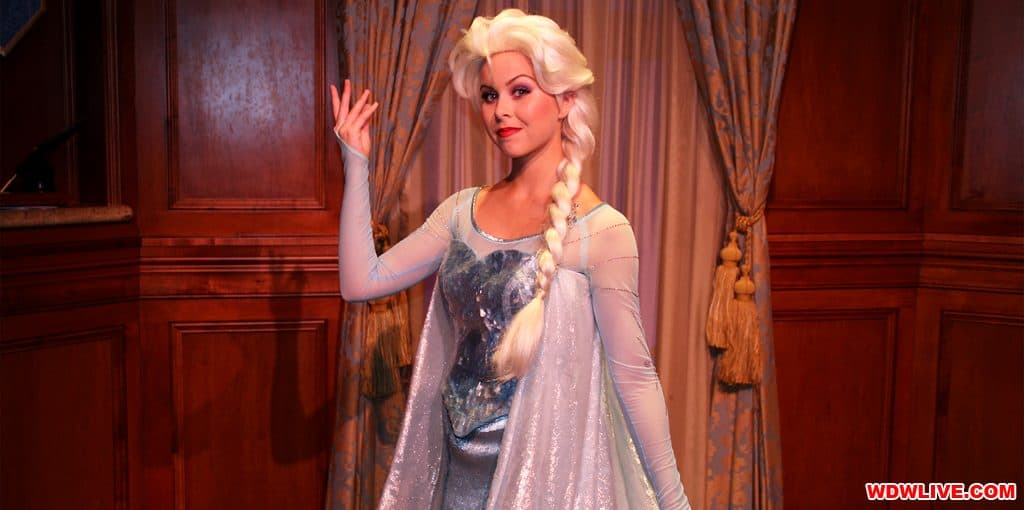 Elsa from Frozen dazzles in her iconic blue gown and cape, enchanting guests with a touch of Disney musical magic.
