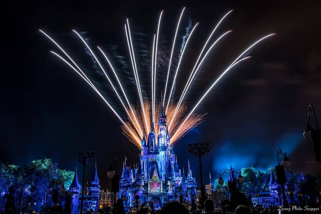 Fireworks sparkle above Cinderella Castle, lighting up Magic Kingdom’s night sky as guests gather for an unforgettable Disney show.