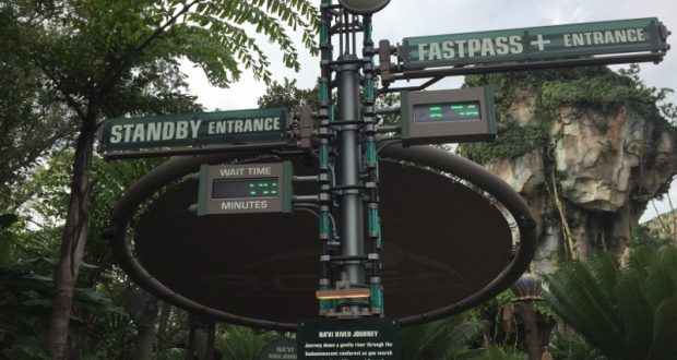Avatar Flight of Passage entrance signs for Standby and FastPass+ lineups, set amid lush greenery in Disney’s Animal Kingdom.
