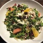 Colorful salad with greens, feta, citrus, seeds, and cranberries—an energizing bite between Disney rides or after Planet Hollywood.