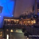 Planet Hollywood Observatory’s sleek blue-lit restaurant features iconic movie memorabilia—an essential Disney World dining hotspot.