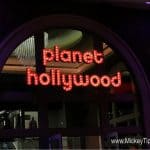 Illuminated "Planet Hollywood Observatory" sign marks the entrance; www.MickeyTips.com in corner, ideal for Disney fans.