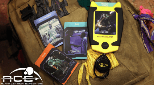 Na'vi Translator and cards with "I SEE YOU" on an ACE-branded bag, inspired by Pandora – The World of Avatar at Disney World.