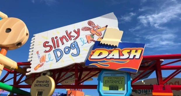 Slinky Dog Dash entrance sign pops with color beneath a sunny sky, welcoming guests to the fun of Disney’s Hollywood Studios.