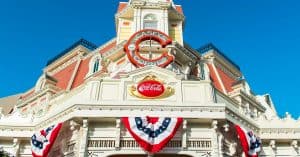 Casey’s Corner at Magic Kingdom sports festive red, white, and blue bunting against a bright blue Florida sky.