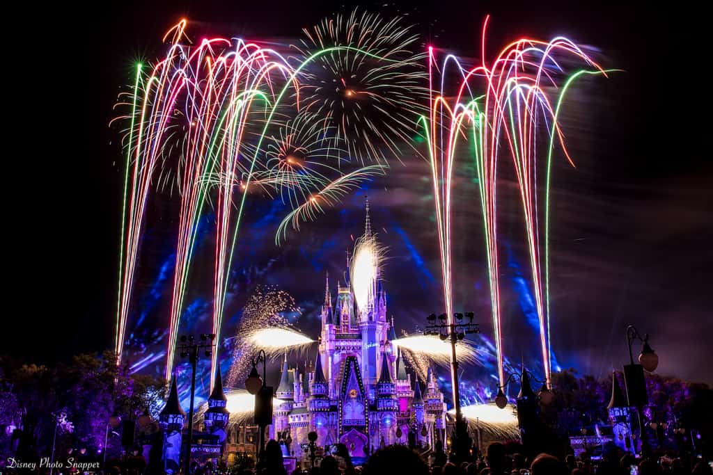 Fireworks burst above Cinderella Castle at Walt Disney World, lighting up the night for an enchanting theme park experience.