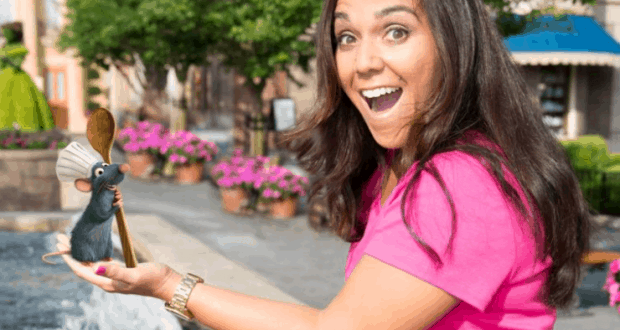 A guest at Epcot presents Chef Remy, the beloved rat from Ratatouille, magically appearing in her palm during a Magic Shot.
