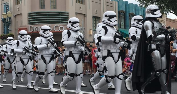 Stormtroopers and Captain Phasma march through Hollywood Studios, thrilling Star Wars fans. Check tips for the best viewing spots!.
