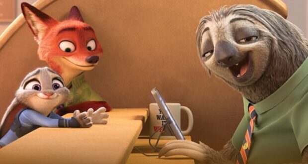 A smiling sloth in a green shirt sits behind a desk, holding a tablet. A fox and a rabbit, both looking happy, are on the other side of the counter. A mug with writing is near the sloth.