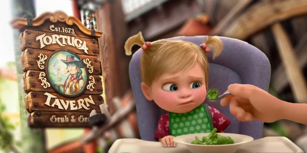 A young child with pigtails sits in a high chair, frowning at a spoonful of broccoli. Beside her, a wooden sign reads “Tortuga Tavern Grub & Grog”—one of the Worst Quick Service Restaurants at Disney World—featuring a pirate illustration.