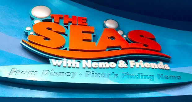 Vibrant “The Seas with Nemo & Friends” sign pops against a blue backdrop, welcoming guests to this kid-friendly EPCOT adventure.