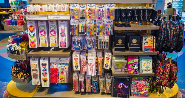 Disney Parks display of vibrant themed pens, notebooks, bookmarks, and stickers—top gift picks for fans and collectors.