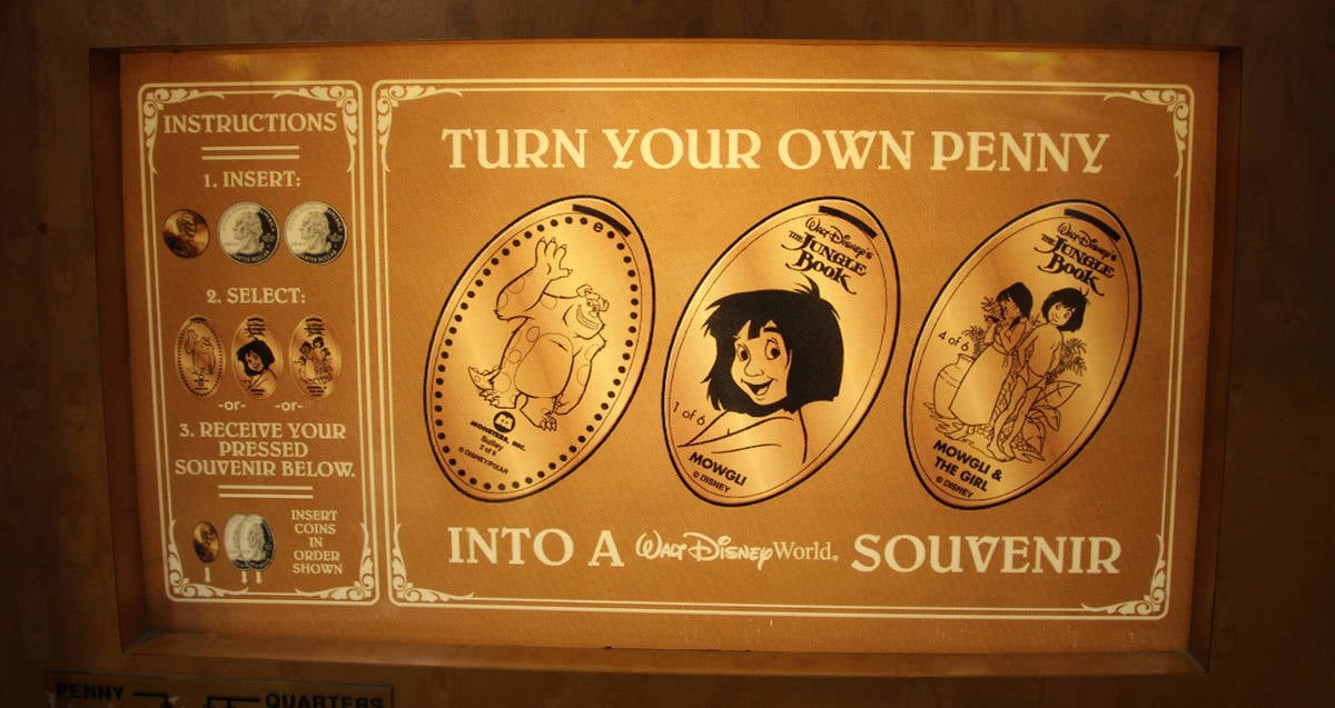 Jungle Book pressed penny machine at Disney's Pop Century Resort, with step-by-step instructions for creating your collectible souvenir.