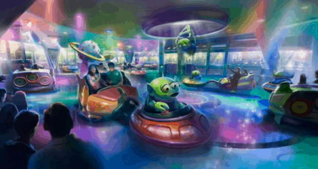 Guests spin in playful green alien saucers on the vibrant Alien Swirling Saucers ride at Hollywood Studios in Disney World.