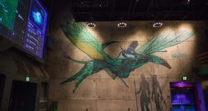 Spectacular mural of a rider on a flying creature from Pandora, glowing softly at Animal Kingdom in Walt Disney World.