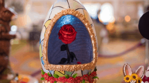 Beauty and the Beast-inspired Easter Egg at Walt Disney World featuring a decorated egg with an enchanting red rose inside.