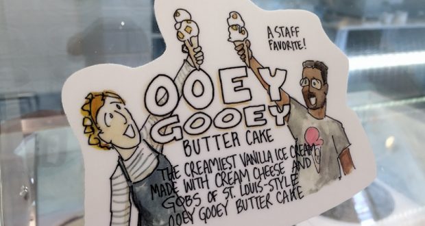 Cartoon of two Disney fans with ice cream cones over "Ooey Gooey Butter Cake"—a top Walt Disney World-inspired flavor.