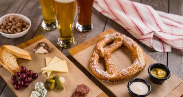 Warm Bavarian pretzel with cheese served at BaseLine Tap House in Disney’s Hollywood Studios, perfect for theme park snacking.